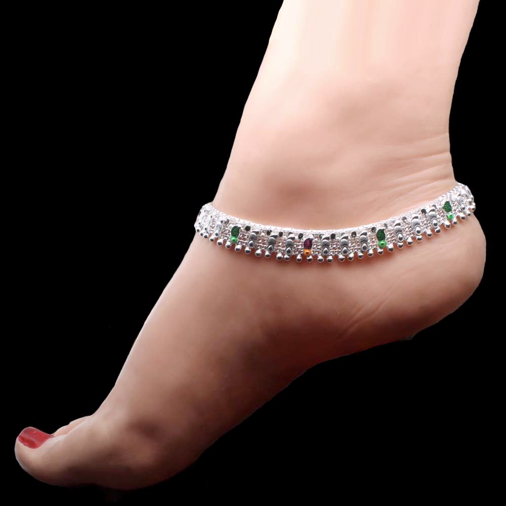 Bridal silver anklets in silver worn by women on foot.