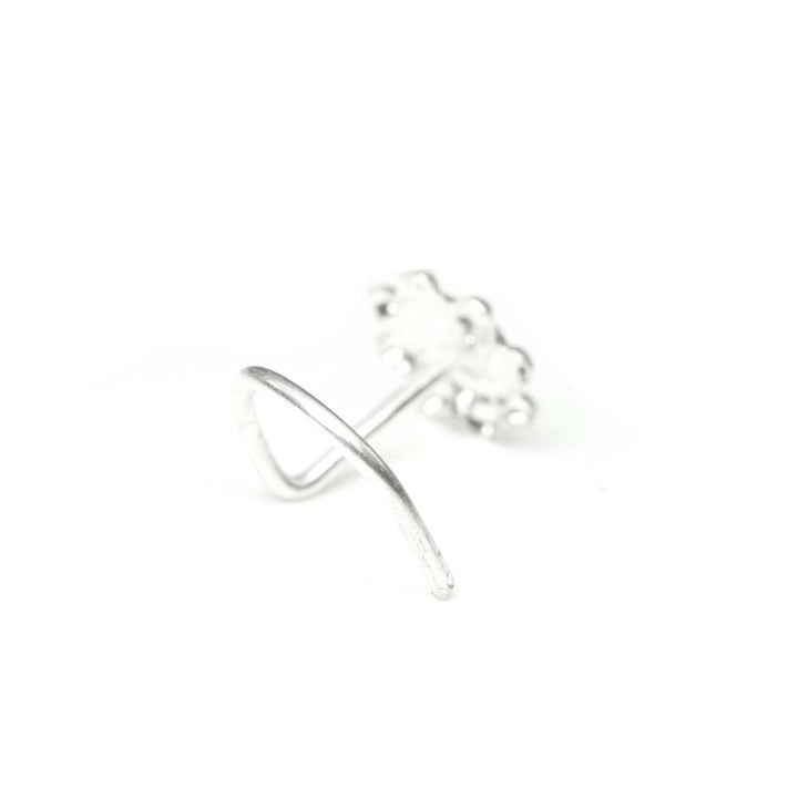 Twisted wire nose piercing ring in silver metal.